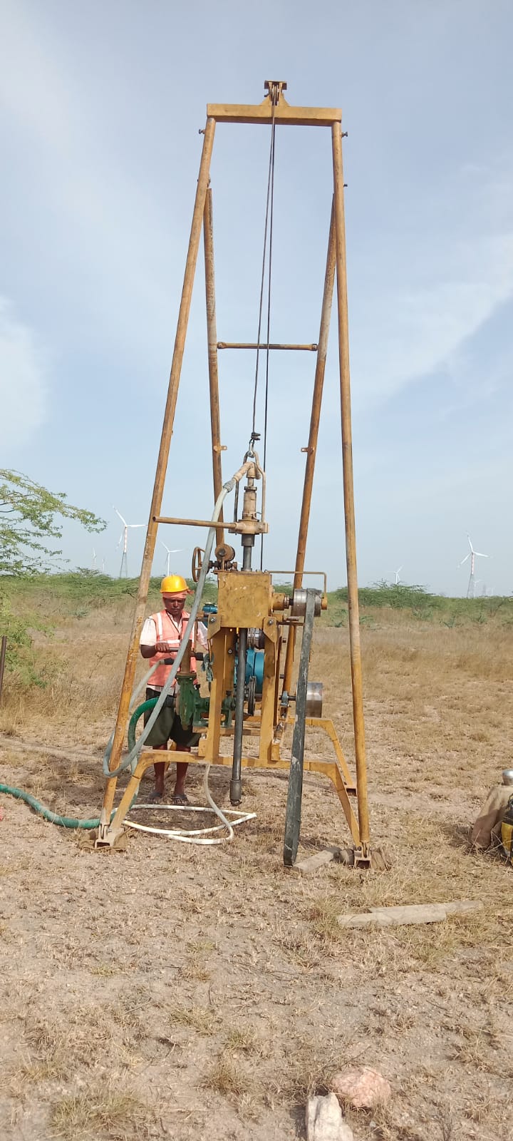 Geotechnical engineers conducting soil investigation in South India